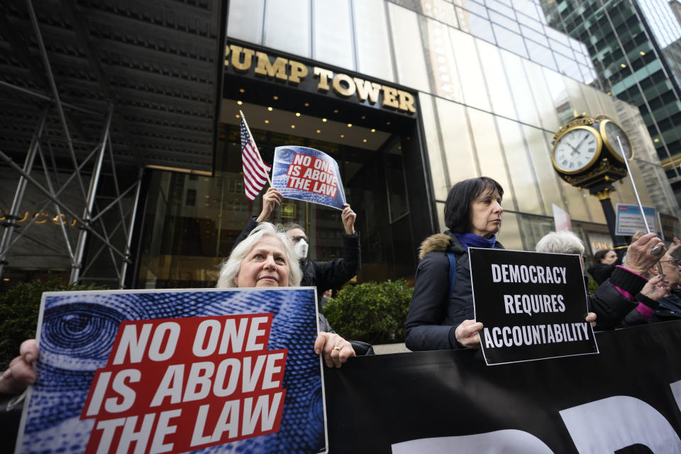 FILE - Protesters gather outside Trump Tower Friday, March 31, 2023, in New York. Within days, Donald Trump could potentially have his sprawling real estate business empire ordered “dissolved” for repeated misrepresentations on financial statements to lenders, adding him to a short list of scam marketers, con artists and others who have been hit with the ultimate punishment for violating New York’s powerful anti-fraud law. An Associated Press analysis of nearly 70 years of civil cases under the law showed that such a penalty has only been imposed a dozen previous times. (AP Photo/Bryan Woolston, File)