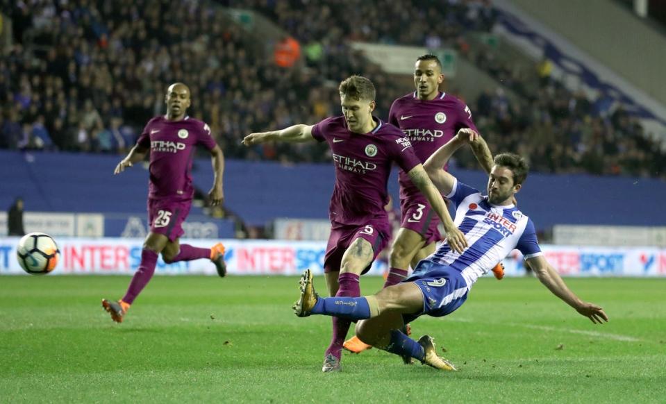 Will Grigg’s goal against Manchester City in 2018 resulted in Wigan’s most recent FA Cup upset (PA)
