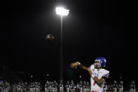 Los Alamitos High School quarterback Malachi Nelson (7) throws on the sideline during a high school football game against Newport Harbor High School on Friday, Sept. 30, 2022, in Newport Beach, Calif. (AP Photo/Ashley Landis)