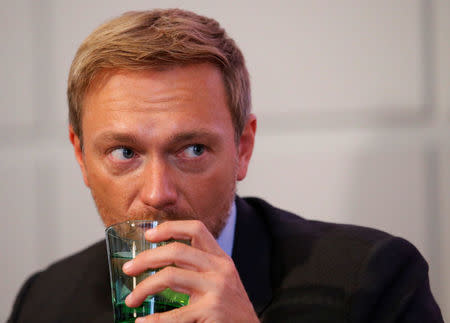 Germany's Free Democratic Party FDP leader Christian Lindner listens during a news conference in Vienna, Austria, October 11, 2017. REUTERS/Heinz-Peter Bader