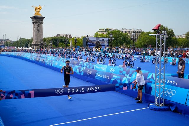 Alex Yee crosses the finish line