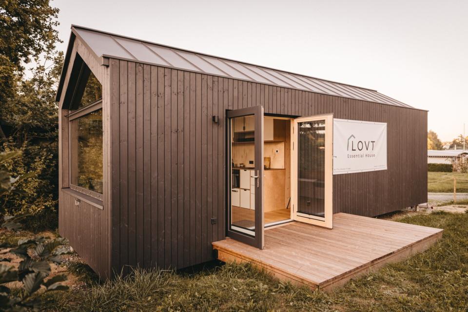 The 275-square-foot LOVT prefab is a feast of crisp millwork, with a modular daybed stacked on drawers and kitchen cabinets with cutouts for pulls.
