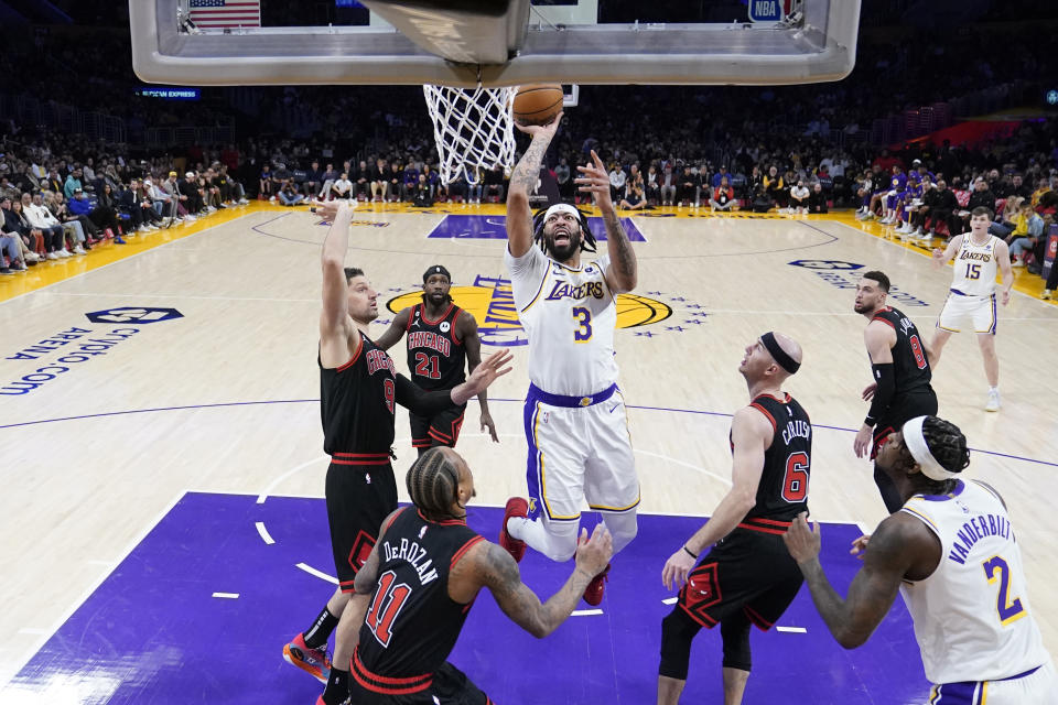 Los Angeles Lakers forward Anthony Davis (3) shoots against the Chicago Bulls during the first half of an NBA basketball game Sunday, March 26, 2023, in Los Angeles. (AP Photo/Marcio Jose Sanchez)