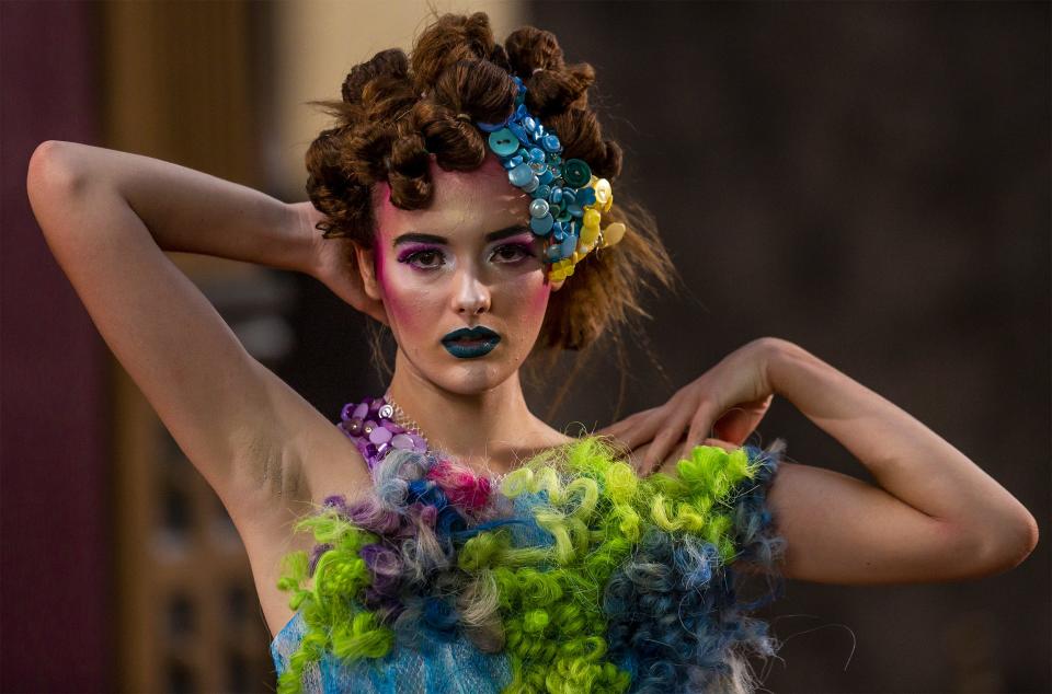 Model Willa Pettit posed for the camera during filming for 'KMAC Couture: Star Stuff' in downtown Louisville. Friday, July 10, 2020.