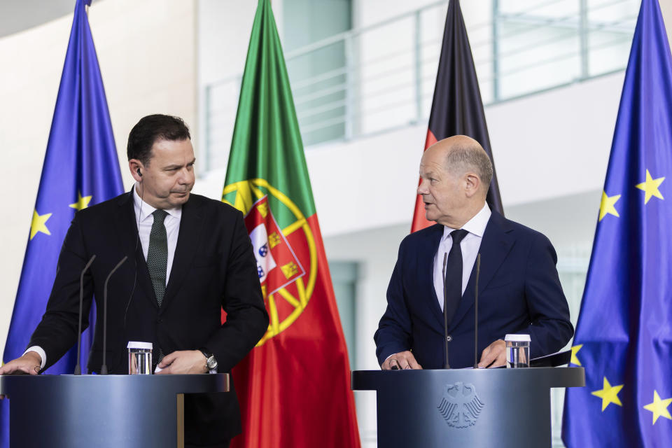 German Chancellor Olaf Scholz, right, and Prime Minister of Portugal Luis Montenegro hold a joint press conference following talks at the Federal Chancellery, in Berlin, Friday May 24, 2024. (Christoph Soeder/dpa via AP)