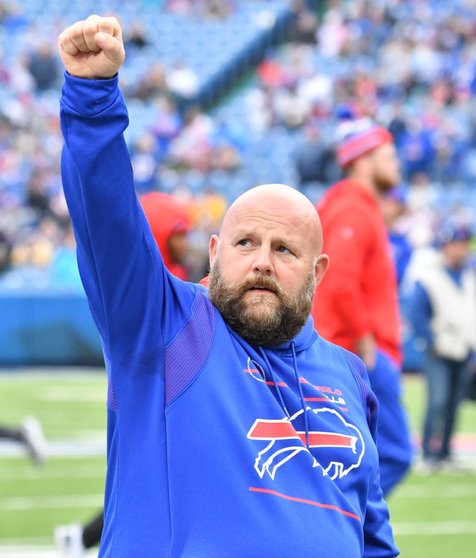 Bills offensive coordinator Brian Daboll reacts to fans at Highmark Stadium in Buffalo before their game against the Dolphins in October.