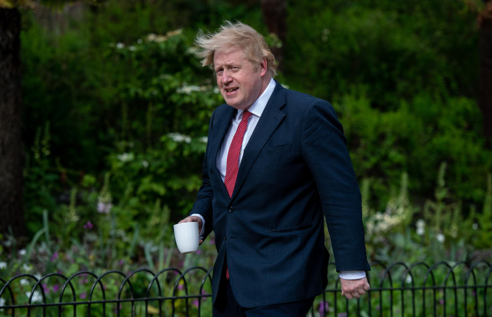 LONDON, ENGLAND  - MAY 11: British Prime Minister, Boris Johnson, takes a walk in St. James park in the morning ahead of meeting with Parliament later in the day on May 11, 2020 in London, United Kingdom. The prime minister announced the general contours of a phased exit from the current lockdown, adopted nearly two months ago in an effort curb the spread of Covid-19. (Photo by Chris J Ratcliffe/Getty Images)