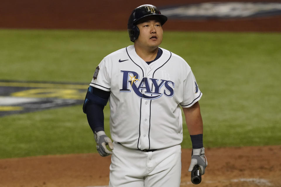 Tampa Bay Rays' Ji-Man Choi walks to the dugout after striking out during the second inning in Game 3 of the baseball World Series against the Los Angeles Dodgers Friday, Oct. 23, 2020, in Arlington, Texas. (AP Photo/Tony Gutierrez)