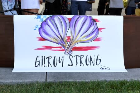 FILE PHOTO: A painting by Gilroy resident Ignacio "Nacho" Moya on the stage at a vigil for those who died and were injured at the mass shooting at the Gilroy Garlic Festival