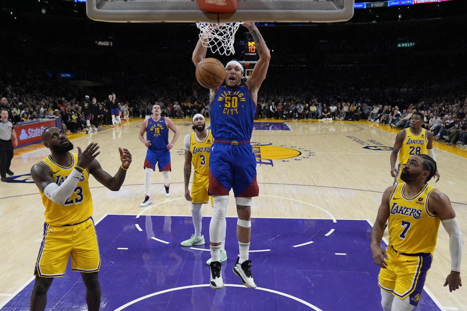 Denver Nuggets forward Aaron Gordon (50) dunks during the second half of Game 3 of an NBA basketball first-round playoff series against the Los Angeles Lakers in Los Angeles, Thursday, April 25, 2024. (AP Photo/Ashley Landis)