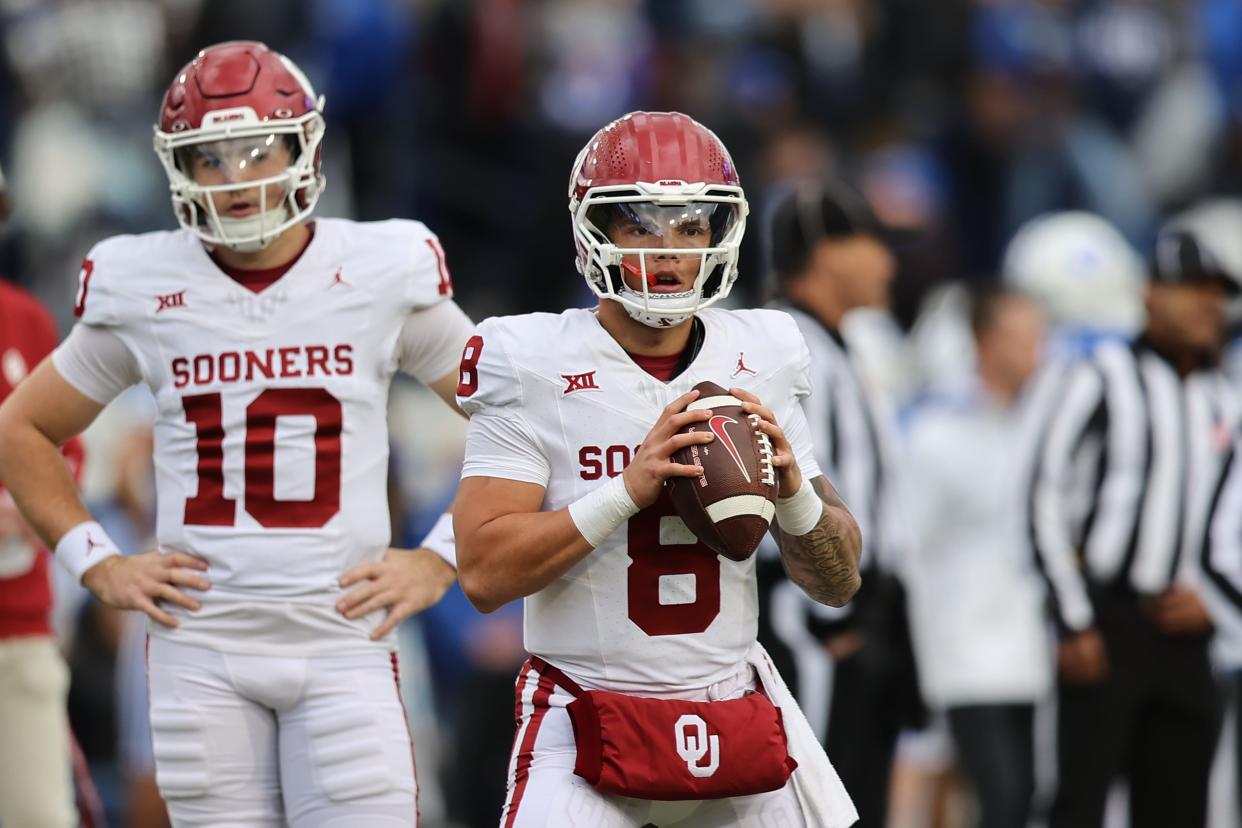 OU backup quarterback Jackson Arnold (10) watches starter Dillon Gabriel (8) warm up before the Sooners' game at BYU last Saturday.