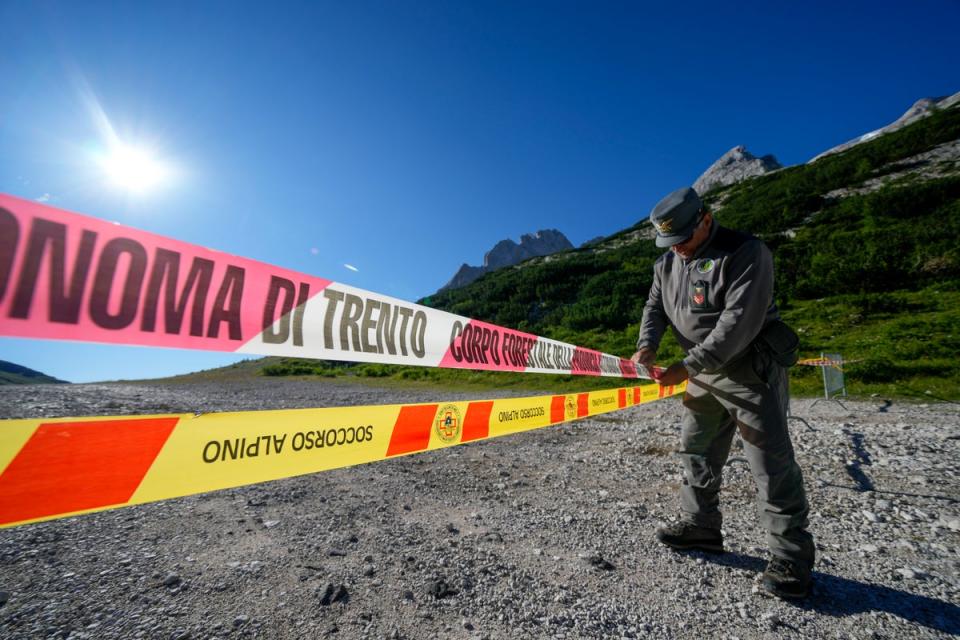 Access to the glacier has been blocked by police officers (AP)