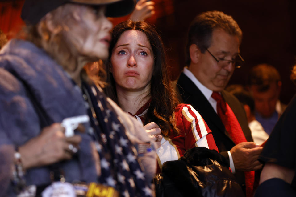 A supporter of Republican gubernatorial candidate Lee Zeldin reacts as media outlets begin to call the race for Democratic incumbent Kathy Hochul at Zeldin's election night party, Tuesday, Nov. 8, 2022, in New York. (AP Photo/Jason DeCrow)