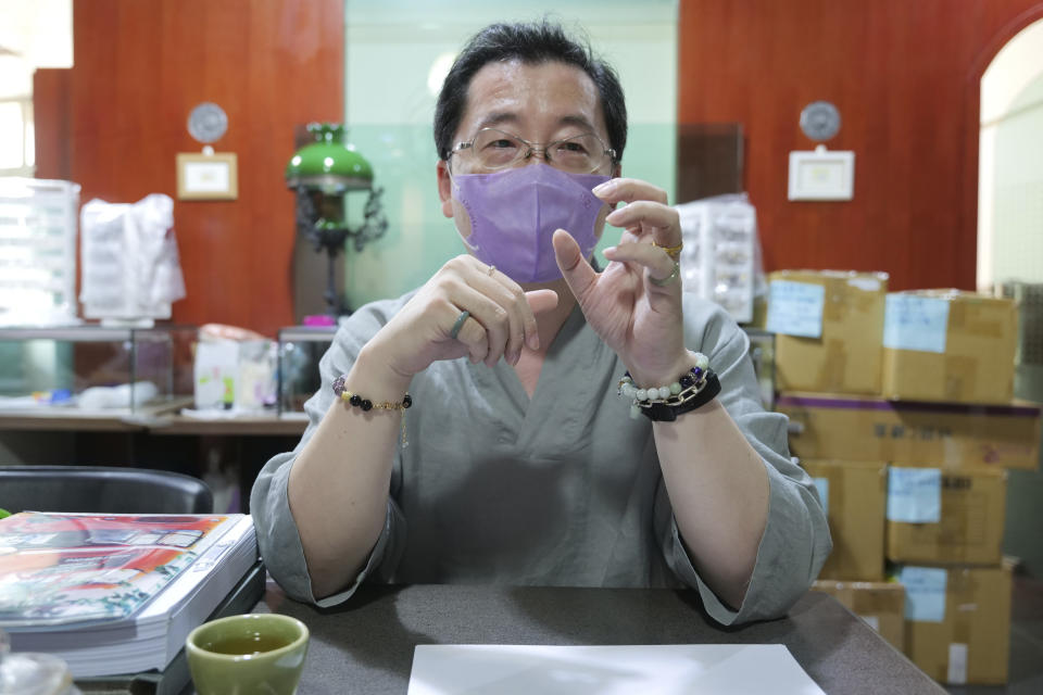 Adams Chi, a member of a group of Taiwanese who lose loved ones to COVID and are seeking compensation from the government, speaks during an interview on Sept. 23, 2021, Taipei, Taiwan. The island is hailed globally as a pandemic success story. But for Chi and other families who lost loved ones, they are angry that their government did not prepare enough and they don't believe it's a success. (AP Photo/Huizhong Wu)