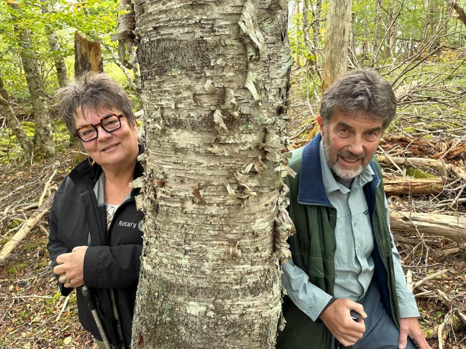 Louisa Horne, left, and Ray Mattholie are two of the volunteers who want to turn the land behind St. Paul's Anglican Church in French Village, N.S., into a conservation site and natural burial ground.