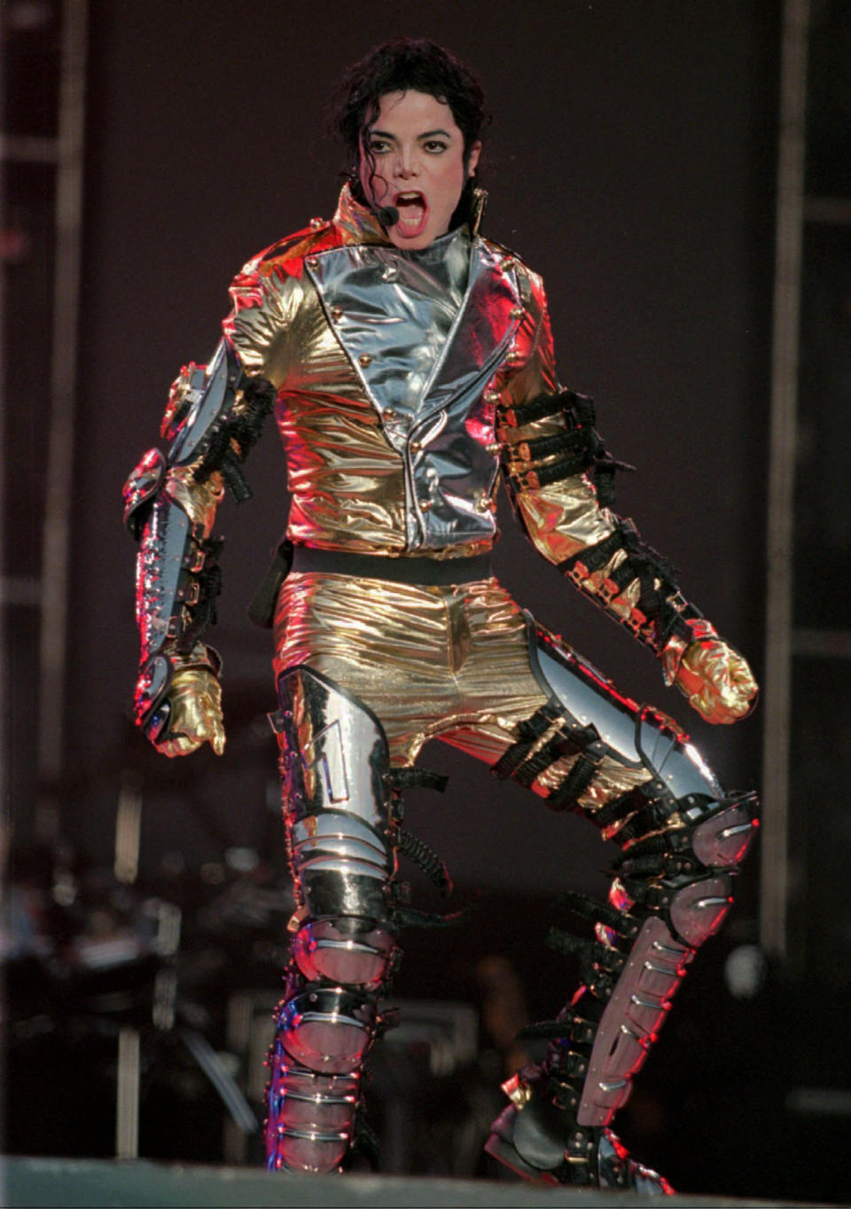 FILE - In this May 31, 1997 file photo, U.S. Popstar Michael Jackson performs during the opening concert of his "HIStory Tour Part II" across Germany and Europe at the Weserstadion in Bremen, North Germany. Jackson's earning potential may become an issue when a Los Angeles jury begins deliberating a negligent hiring lawsuit filed by the singer's mother, Katherine Jackson, against concert giant AEG Live LLC over her son's 2009 death. Witnesses have testified throughout the 21-week trial that the pop superstar was planning a new career in movies after completing his "This Is It" tour that was scheduled to begin in July 2009. (AP Photo/Joerg Sarbach)