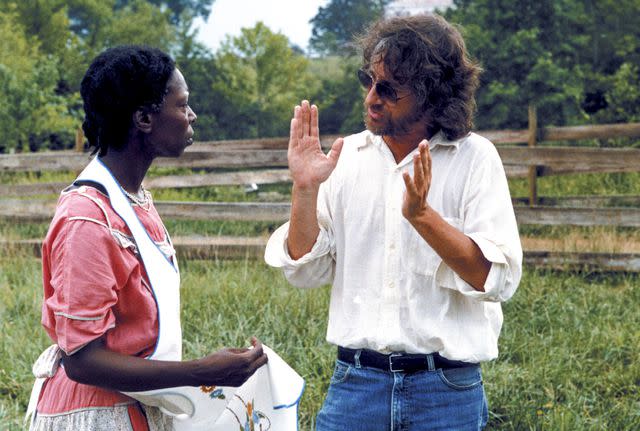<p>Everett Collection</p> Whoopi Goldberg and Steven Spielberg on the set of 'The Color Purple'