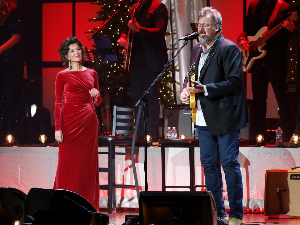 Amy Grant and Vince Gill perform at the Ryman Auditorium on December 12, 2022 in Nashville, Tennessee