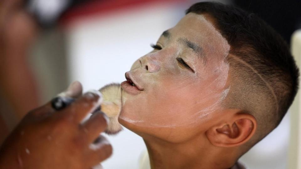 A participant has his face painted in preparation for the Cape Minstrel Carnival, in Cape Town, South Africa - Tuesday 2 January 2024