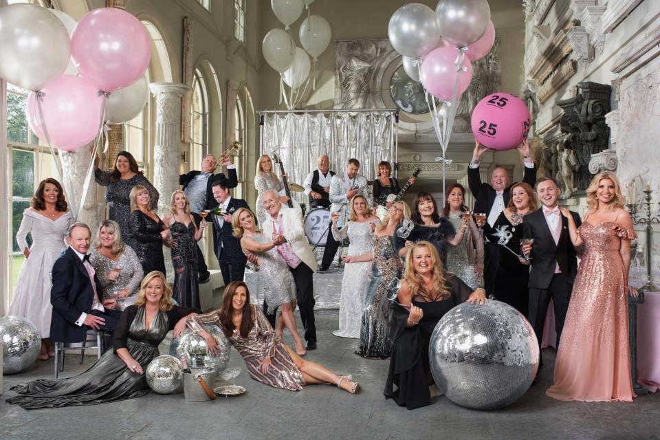 Winners from each year of the lottery's existence posing for a Vanity Fair-style photo shoot to mark The National Lottery's 25th anniversary (PA)