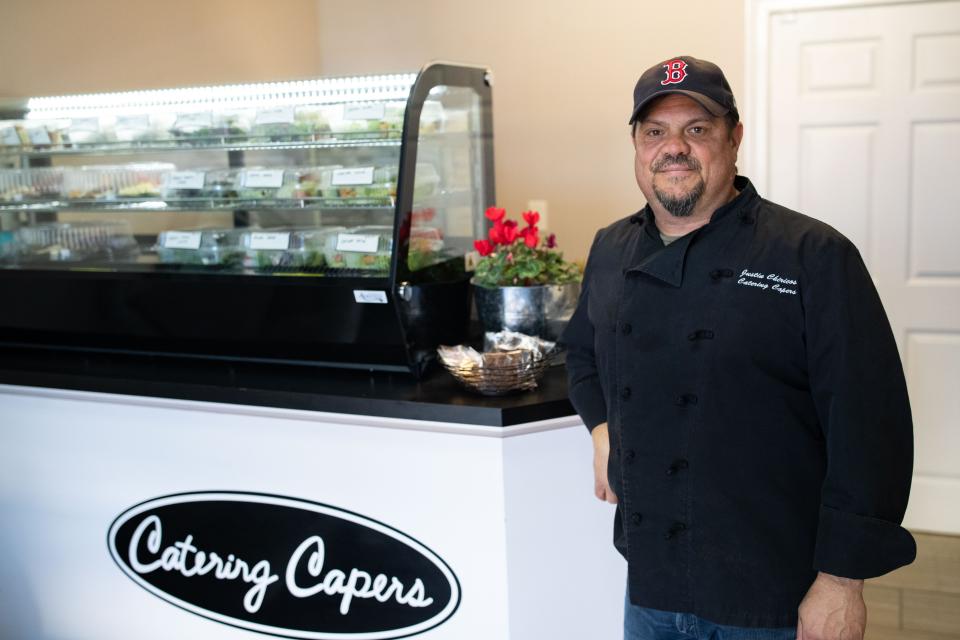 Owner of Catering Capers, Justin Chiricos poses for a portrait in his store front Wednesday, Jan. 31, 2024.