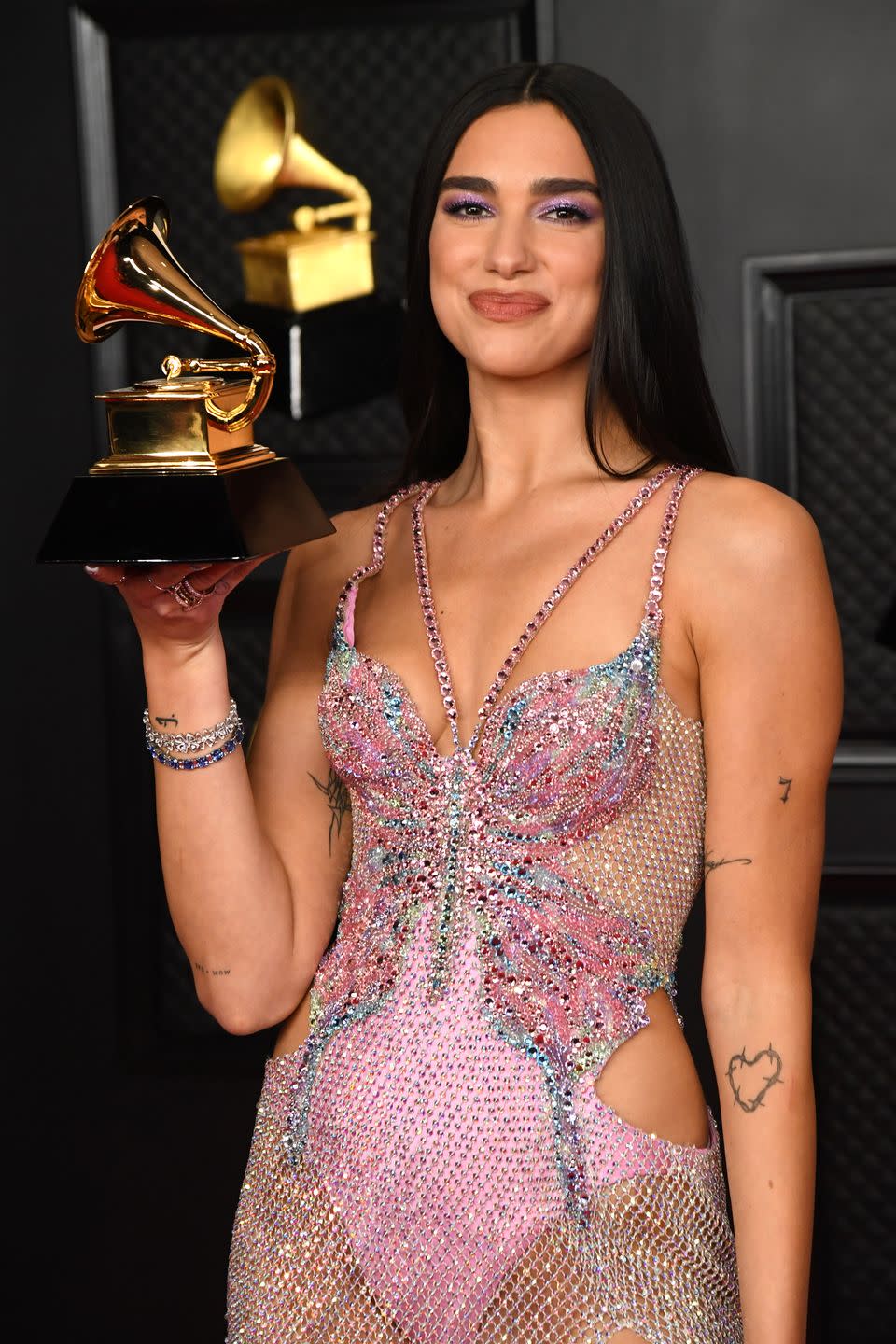 los angeles, california   march 14 dua lipa, winner of best pop vocal album for ‘future nostalgia’, poses in the media room during the 63rd annual grammy awards at los angeles convention center on march 14, 2021 in los angeles, california photo by kevin mazurgetty images for the recording academy