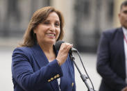 Peru's new President Dina Boluarte makes a statement to the press at the government palace in Lima, Peru, Thursday, Dec. 8, 2022. Peru's Congress voted to remove President Pedro Castillo from office Wednesday and replace him with the vice president, Boluarte, shortly after Castillo tried to dissolve the legislature ahead of a scheduled vote to remove him. (AP Photo/Fernando Vergara)