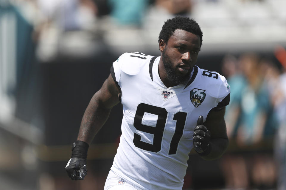 FILE - In this Sept. 8, 2019, file photo, Jacksonville Jaguars' Yannick Ngakoue is introduced during an NFL football game against the Kansas City Chiefs, in Jacksonville, Fla. Disgruntled Jaguars defensive end Yannick Ngakoue made another public plea to be traded, this one on his 25th birthday. Ngakoue said in a Twitter post Tuesday, March 31, 2020 ,“ why hold a man from taking care of his family. It’s obvious my time is up in my current situation. Let’s both move on.”(AP Photo/Perry Knotts, File)