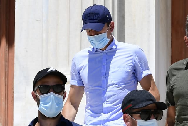 Harry Maguire, centre, leaves a court building on the island of Syros, Greece, on Saturday 