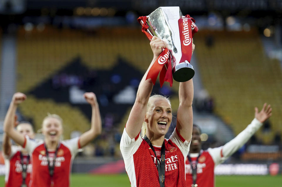 Arsenal's Stina Blackstenius lifts the trophy after winning the FA Women's Continental Tyres League Cup Final soccer match between Arsenal and Chelsea at Molineux Stadium, Wolverhampton, England, Sunday March 31, 2024. (David Davies/PA via AP)
