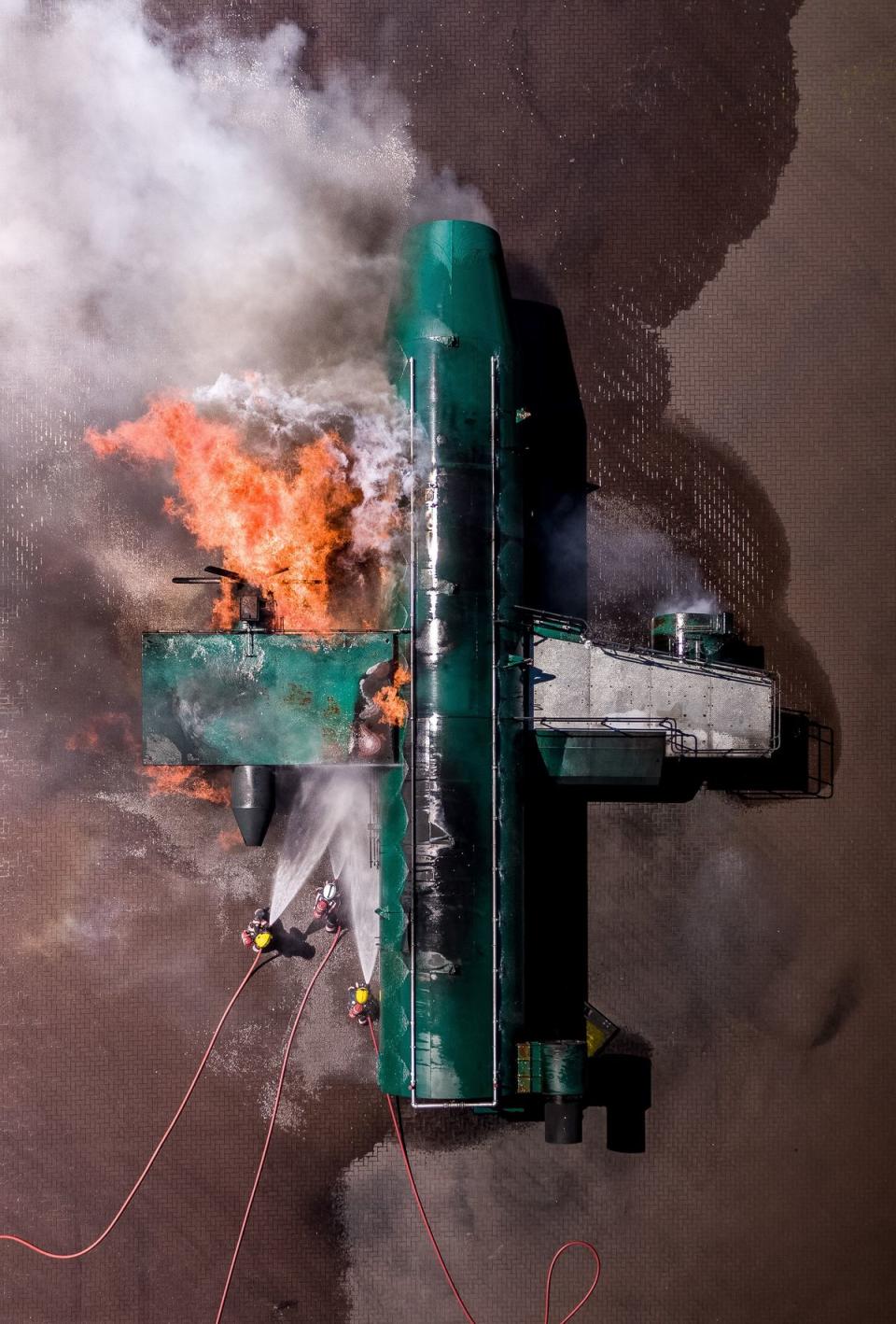 Marc Le Cornu’s photo of the Jersey Airport Rescue & Firefighting Service training on a burning plane (Picture: Marc Le Cornu)