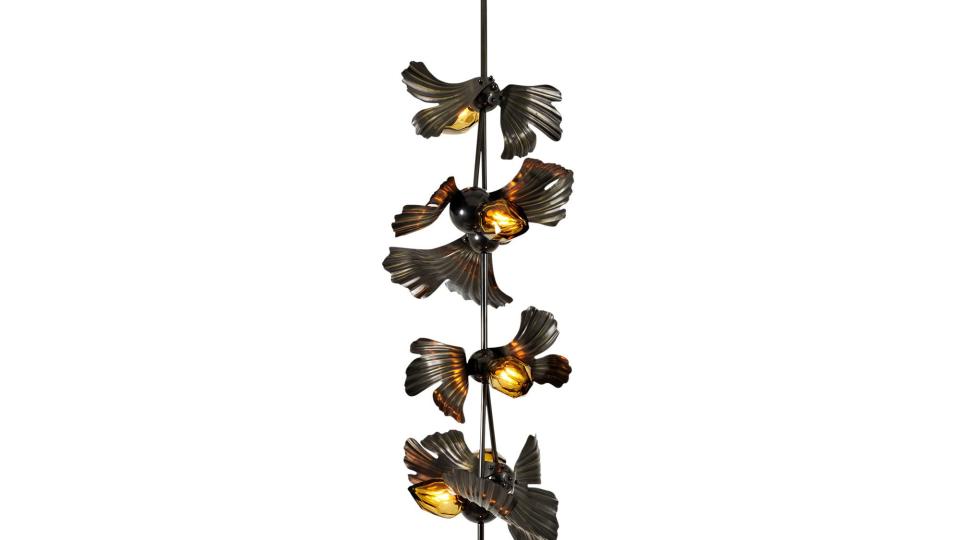 long pendant light with yellow bulbs with wings that make each look like small birds