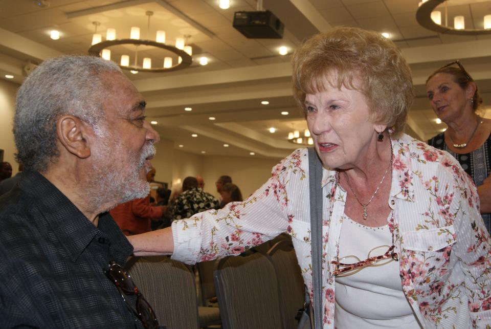 Professional musician Thaddeus Richard, 72, of Thibodaux, meets with fan Becky Theroit, 81, of Houma, at a concert for Richard's 73 birthday Sunday at the Thibodaux Regional Wellness Center.