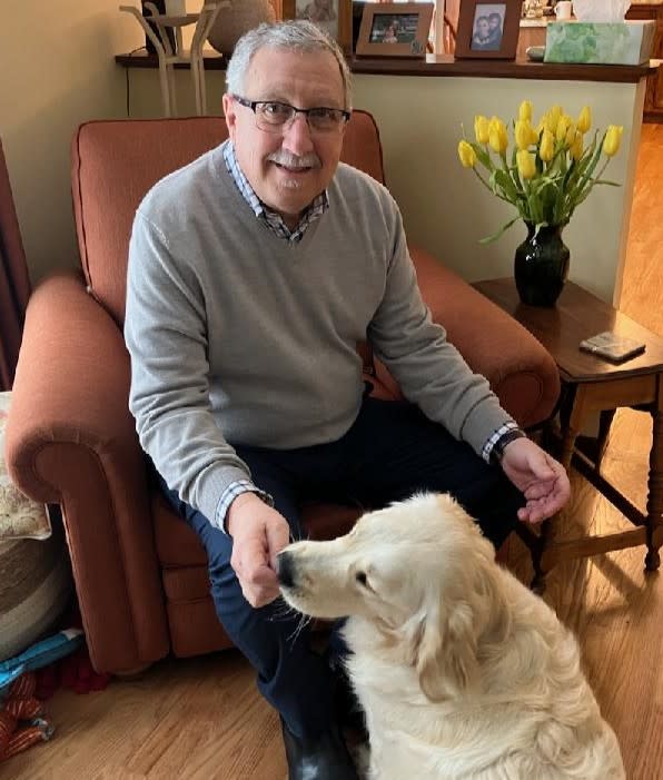 Photo of George Cavedon and his dog, Lily.