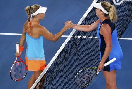 Tennis - Australian Open - Melbourne Park, Melbourne, Australia - early 23/1/17 Coco Vandeweghe of the U.S. shakes hands after winning her Women's singles fourth round match against Germany's Angelique Kerber. REUTERS/Jason Reed