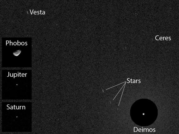 NASA's Curiosity rover snapped an image of the asteroids Ceres and Vesta while taking a shot of the Martian moon Deimos on April 20, 2014 PDT. In other images from that photo session, Curiosity also captured Mars' other moon, Phobos, and the pl