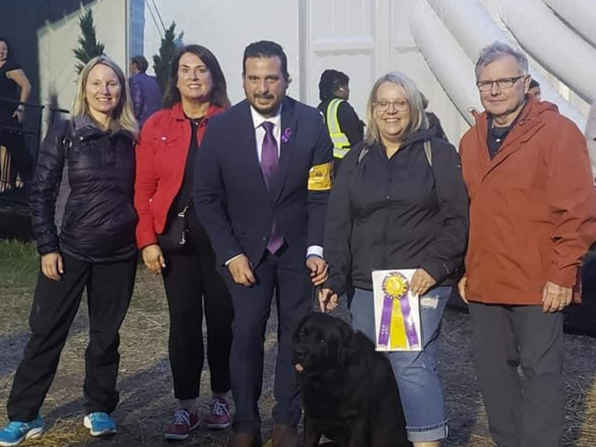 Newfoundland and Labrador Finance Minister and dog breeder Siobhan Coady, second from left, and dog handler Fabian Negron, third from left, say Beau's win makes him one of the top dogs in the world. (Siobhan Coady/Facebook - image credit)