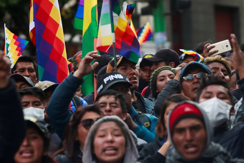 A demonstrator holds a placard during a protest in La Paz