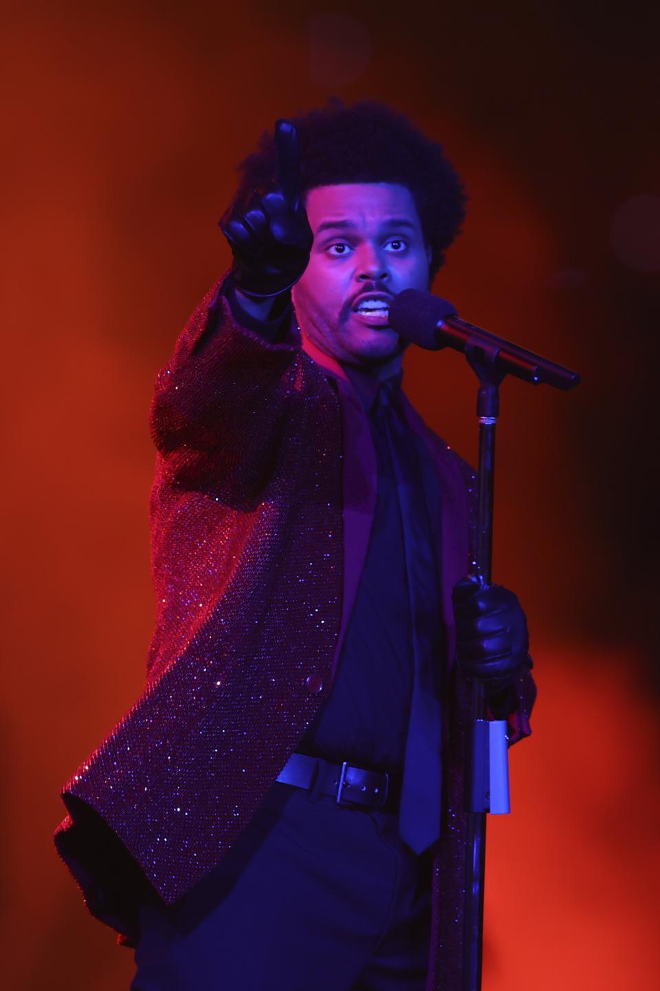 TAMPA, FLORIDA - FEBRUARY 07: The Weeknd performs during the Pepsi Super Bowl LV Halftime Show at Raymond James Stadium on February 07, 2021 in Tampa, Florida. (Photo by Mark LoMoglio - Pool/Getty Images)