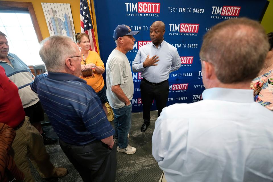 Republican presidential candidate Sen. Tim Scott, R-S.C., greets local residents during a meet and greet, Monday, Sept. 18, 2023, in Fort Dodge, Iowa. (AP Photo/Charlie Neibergall)