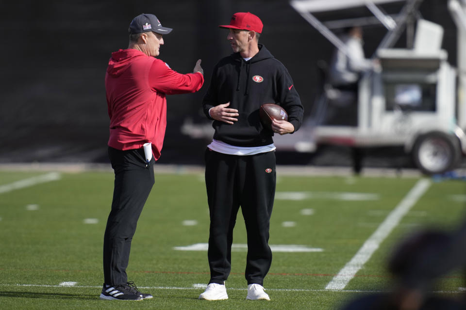 San Francisco 49ers head coach Kyle Shanahan, right, speaks with general manager John Lynch during a practice ahead of the Super Bowl 58 NFL football game Thursday, Feb. 8, 2024, in Las Vegas. (AP Photo/John Locher)
