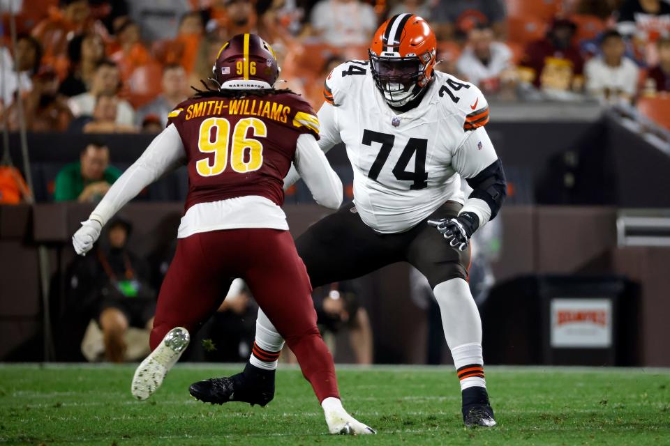 Cleveland Browns offensive lineman Dawand Jones (74) looks to block Washington Commanders defensive end James Smith-Williams (96) during a preseason game on Aug. 11 in Cleveland.