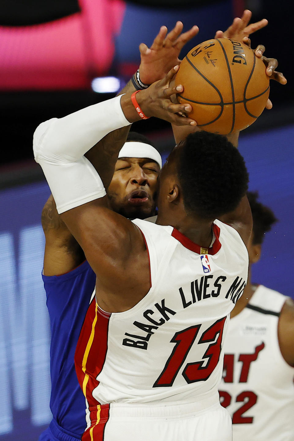 Miami Heat's Bam Adebayo (13) draws a foul from Denver Nuggets' Torrey Craig during an NBA basketball game, Saturday, Aug. 1, 2020, in Lake Buena Vista, Fla. (Kevin C. Cox/Pool Photo via AP)