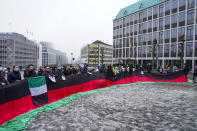 People stage a protest outside the Ministry of Foreign Affairs in Oslo, Norway, Sunday, Jan. 23, 2022. A Taliban delegation led by acting Foreign Minister Amir Khan Muttaqi on Sunday started three days of talks in Oslo with Western officials and Afghan civil society representatives amid a deteriorating humanitarian situation in Afghanistan. The closed-door meetings are taking place at a hotel in the snow-capped mountains above the Norwegian capital. (Torstein Boe/NTB scanpix via AP)