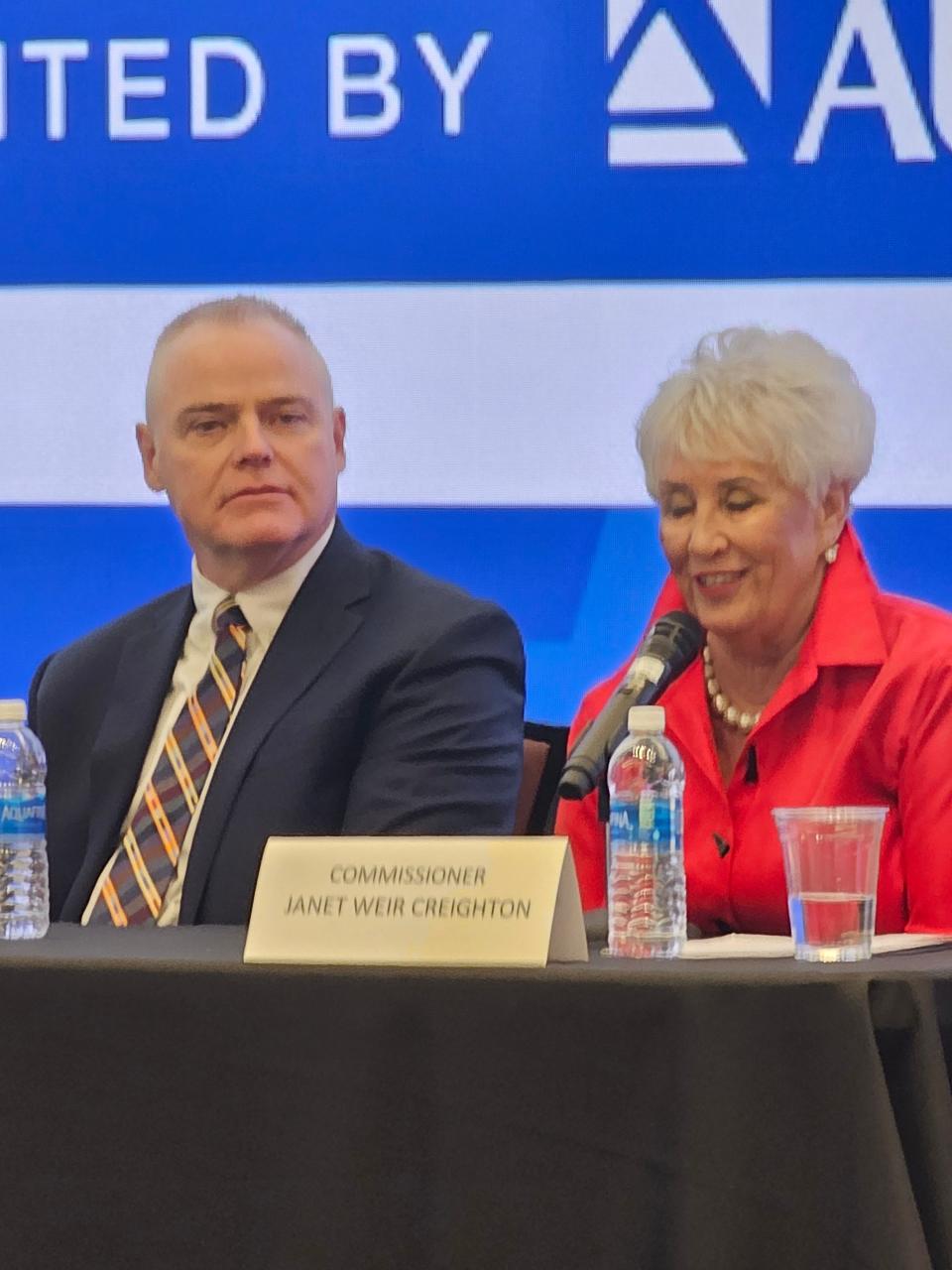 Stark County Commissioner Janet Weir Creighton discusses how collaboration will make Stark County successful while Massillon Mayor Jamie Slutz listens during a forum hosted by the Canton Regional Chamber of Commerce.