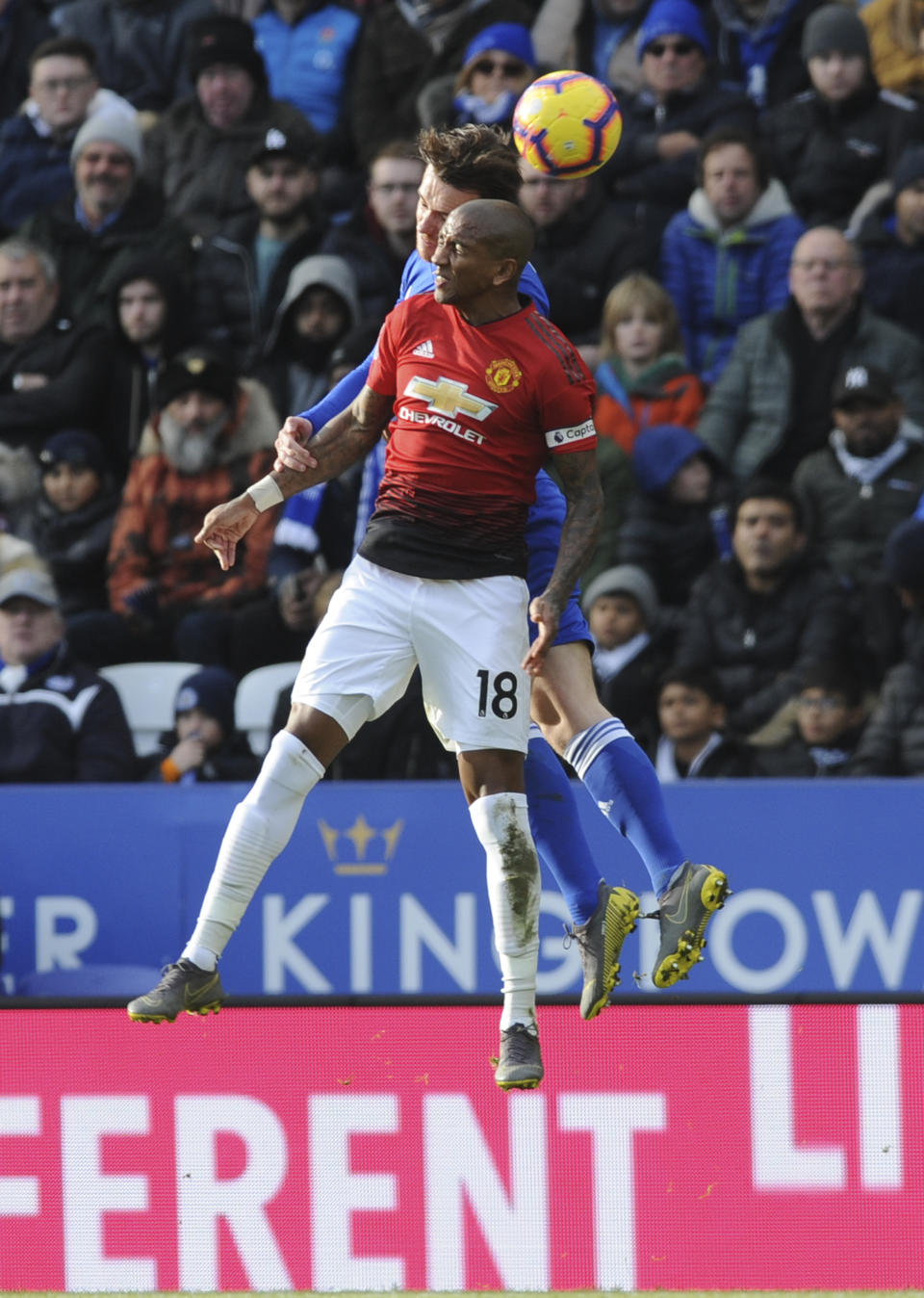 Manchester United's Ashley Young, foreground, and Leicester's Jonny Evans head the ball during the English Premier League soccer match between Leicester City and Manchester United at the King Power Stadium in Leicester, England, Sunday, Feb 3, 2019. (AP Photo/Rui Vieira)