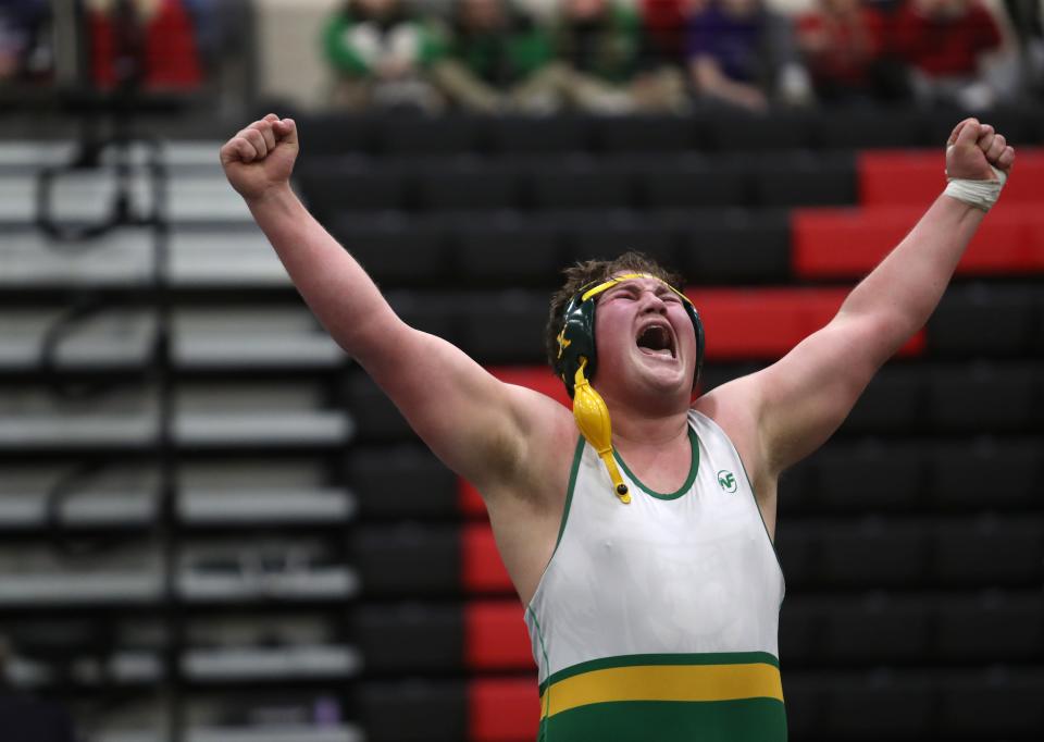 St. Xavier's Carter Guillaume, a standout lineman on the football team, celebrates after winning the 2023 KHSAA State Wrestling’s 285 weight class championship. Feb. 25, 2023