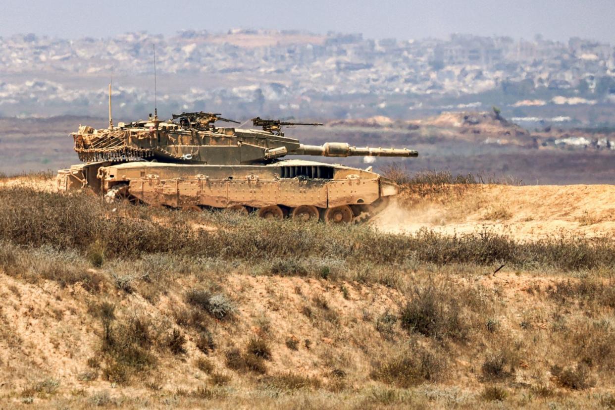 PHOTO: An Israeli army main battle tank moves along an area near the border with the Gaza Strip and southern Israel, July 2, 2024, amid the ongoing conflict in the Palestinian territory between Israel and Hamas.  (Jack Guez/AFP via Getty Images)