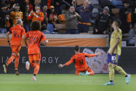 Houston Dynamo forward Corey Baird (11) slides into the stands as he celebrates his goal against Real Salt Lake during the first half of an MLS playoff soccer match Saturday, Nov. 11, 2023, in Houston. (AP Photo/Michael Wyke)