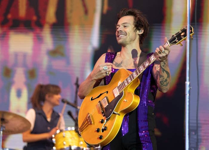 A closeup of Harry performing